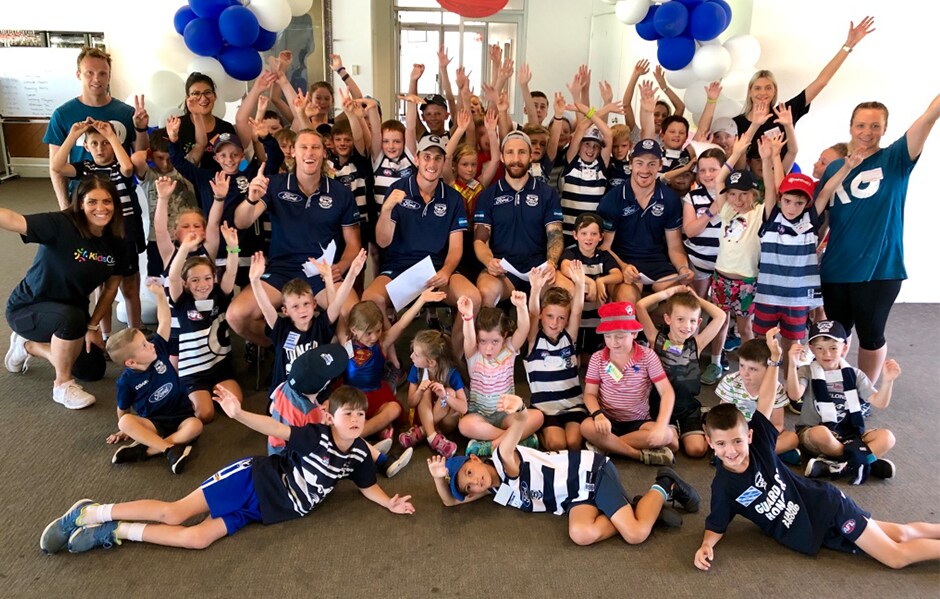 2019_03_15_Kids_HERO.png Participants pose for a photo with players at the last school holiday program. - Geelong Cats